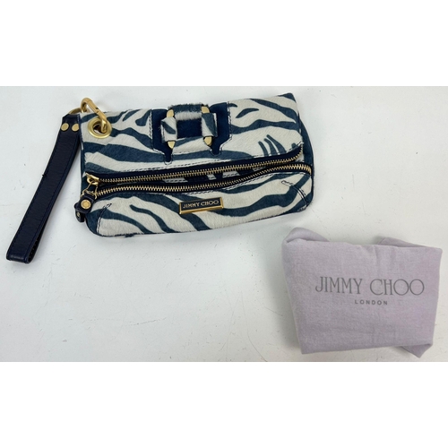 241 - A Jimmy Choo Zebra Stripe Large Clutch Bag. Gilded hardware. Zipped inner and outer compartment. Dus... 