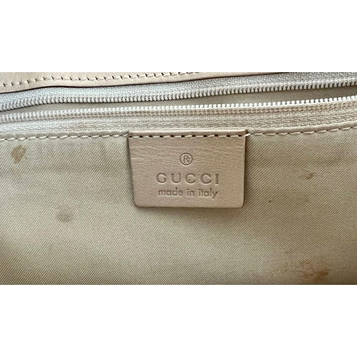 262 - A Gucci Green Canvas and Brown Leather Monogram Handbag. Silver-tone hardware. Zipped interior compa... 