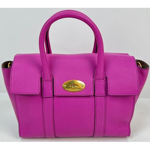 290 - A Mulberry Purple Leather Handbag with Dust Cover. Gilded hardware. Zipped interior compartment. In ... 