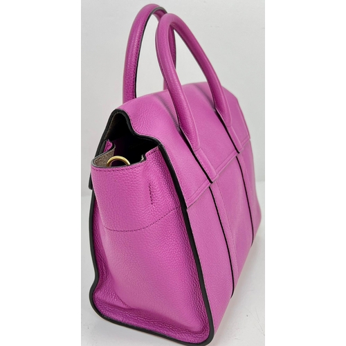 290 - A Mulberry Purple Leather Handbag with Dust Cover. Gilded hardware. Zipped interior compartment. In ... 