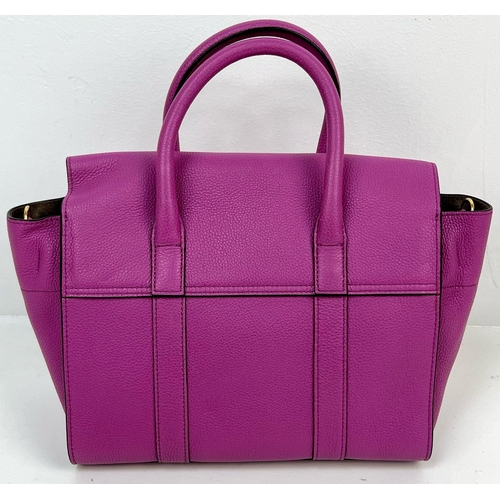 290 - A Mulberry Purple Leather Handbag with Dust Cover. Gilded hardware. Zipped interior compartment. In ... 