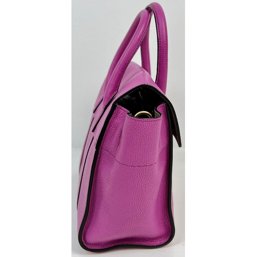 290 - A Mulberry Purple Leather Handbag with Dust Cover. Gilded hardware. Zipped interior compartment. In ... 