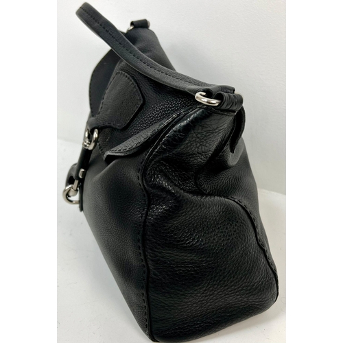 401 - A Large Prada Black Leather handbag with Hook Clasp. Monogram interior with zipped compartment. 30 x... 