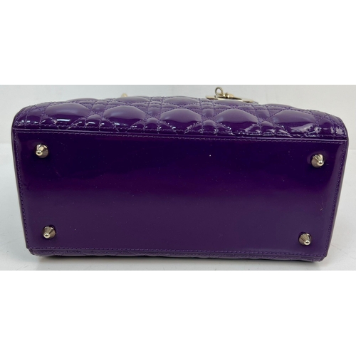 59 - A Christian Dior - Lady Dior Purple Patent Leather Handbag. Gold tone hardware. Detachable shoulder ... 