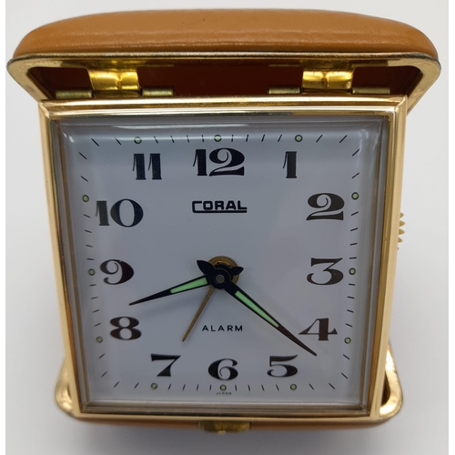 1011 - Vintage Coral Travel Alarm Clock Wind Up, in Faull working order.