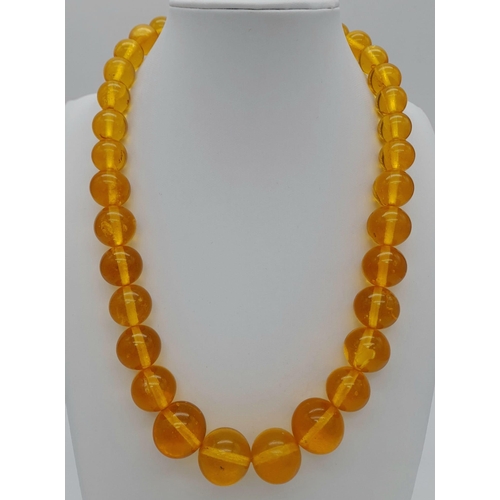 1144 - A ROUND BEADED YELLOW AMBER NECKLACE, WEIGHT 61.5G