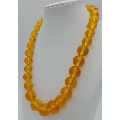 1144 - A ROUND BEADED YELLOW AMBER NECKLACE, WEIGHT 61.5G