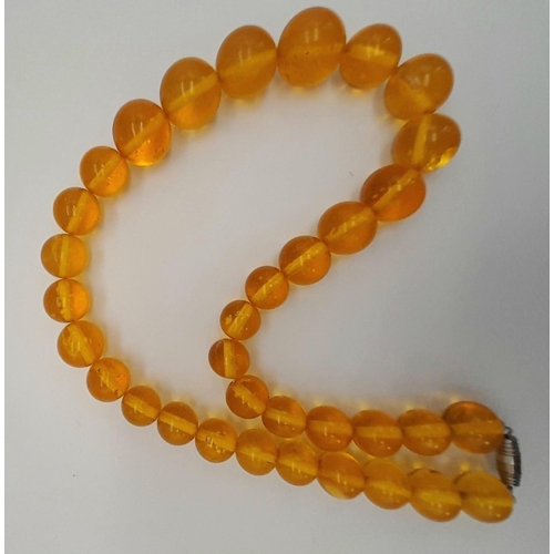 1144 - A ROUND BEADED YELLOW AMBER NECKLACE, WEIGHT 61.5G