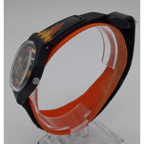 1298 - A Swatch Velcro Strap Fire Watch. Quartz movement in working order.