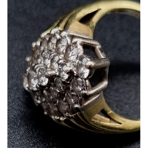 18 - A Browns 18K Yellow and White Gold Diamond Cluster Ring.
Twenty-nine brilliant round cut diamonds. 2... 