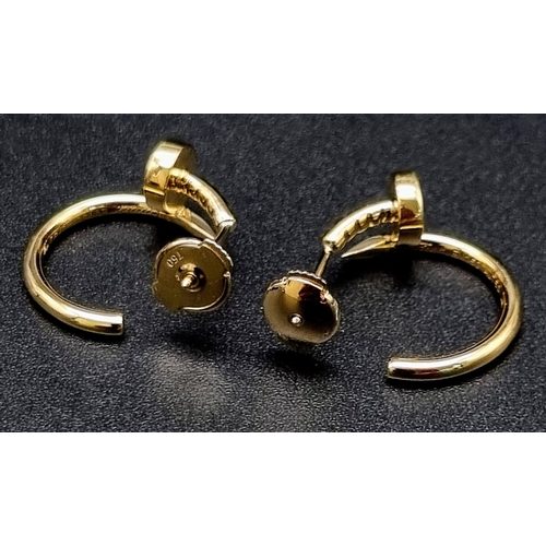 62 - A pair of 18k yellow gold Cartier Juste un Clou hoop earrings. Width: 1.8mm. Inner diameter: 12.75mm... 