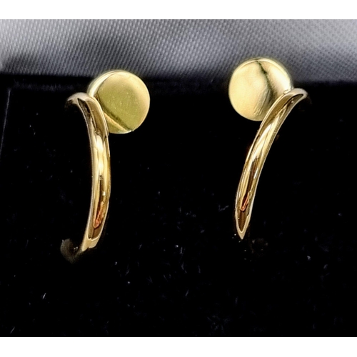 62 - A pair of 18k yellow gold Cartier Juste un Clou hoop earrings. Width: 1.8mm. Inner diameter: 12.75mm... 