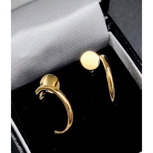 62 - A pair of 18k yellow gold Cartier Juste un Clou hoop earrings. Width: 1.8mm. Inner diameter: 12.75mm... 