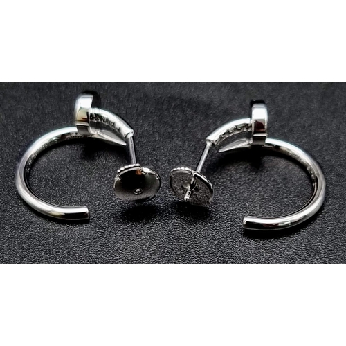 637 - A pair of 18k white gold Cartier Juste un Clou hoop earrings. Width: 1.8mm. Inner diameter: 12.75mm.