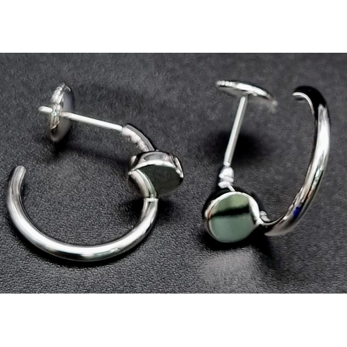 637 - A pair of 18k white gold Cartier Juste un Clou hoop earrings. Width: 1.8mm. Inner diameter: 12.75mm.