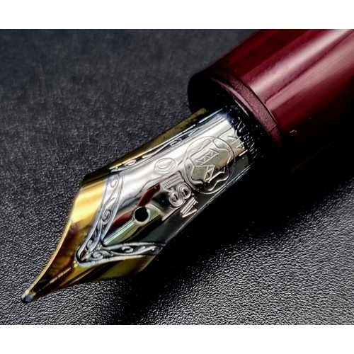 878 - A Mont Blanc 4810 Burgundy Fountain Pen with 14K White Gold Nib.  Comes in a Mont Blanc Box. Ref: 10... 