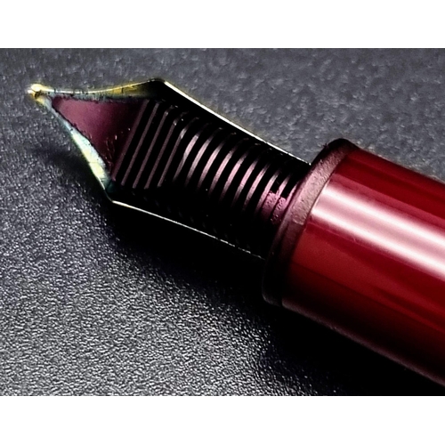 878 - A Mont Blanc 4810 Burgundy Fountain Pen with 14K White Gold Nib.  Comes in a Mont Blanc Box. Ref: 10... 