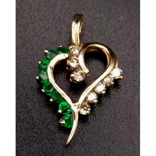 1028 - 14K Yellow Gold Diamond and Emerald Heart Pendant. Weighs 1g