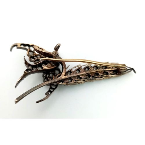 228 - 9K Yellow Gold Swallow Brooch set with old cut Diamonds and a ruby eye.
1.10ct Approx
weighs 5.9g