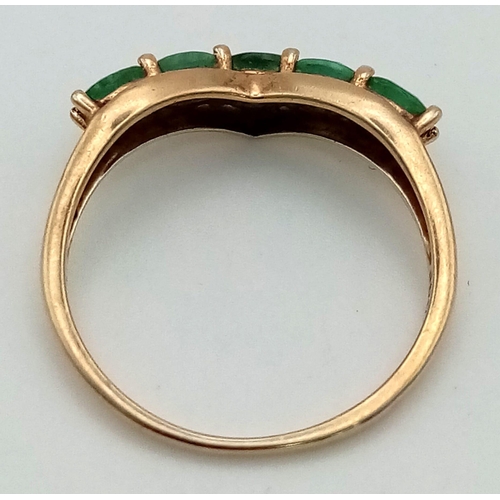 373 - A Green Emerald 10K Gold Gemstone Chevron Ring. Five stones. Size P/Q. 1.81g total weight.