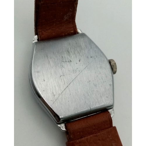 990 - A VINTAGE MILITARY STYLE WRIST WATCH WITH MANUAL MOVEMENT AND LEATHER STRAP.  32mm   FWO.