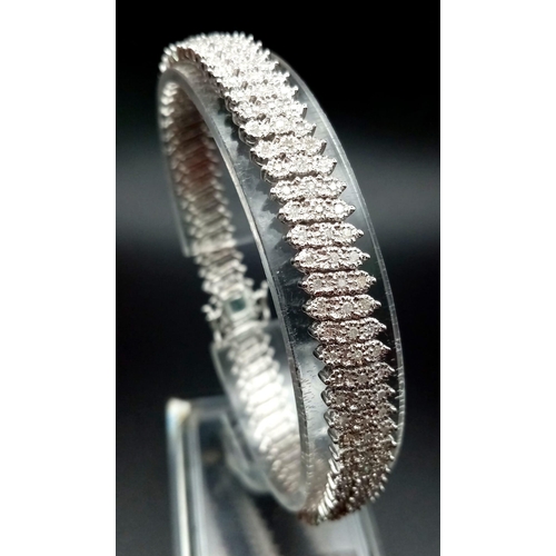 100 - A VERY PRETTY 9K WHITE GOLD WITH 3 ROWS OF DIAMOND SET BRACELET, WITH APPROX 1.50CT DIAMONDS, WEIGHT... 