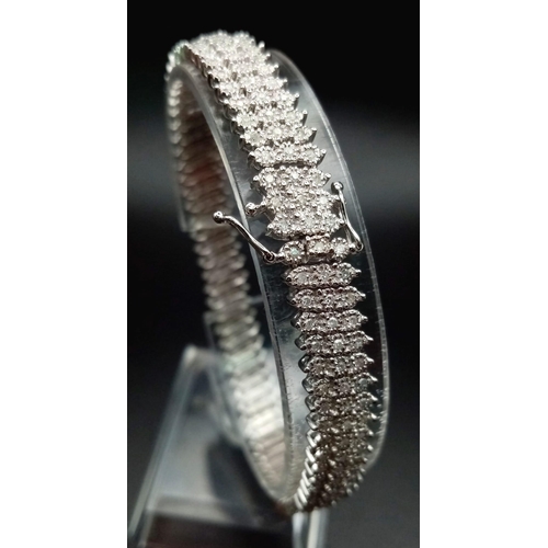 100 - A VERY PRETTY 9K WHITE GOLD WITH 3 ROWS OF DIAMOND SET BRACELET, WITH APPROX 1.50CT DIAMONDS, WEIGHT... 