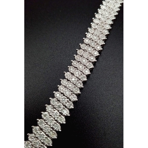 100 - A VERY PRETTY 9K WHITE GOLD WITH 3 ROWS OF DIAMOND SET BRACELET, WITH APPROX 1.50CT DIAMONDS, WEIGHT... 