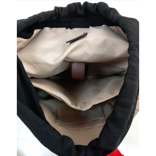 316 - A GUCCI FULL SIZE BACKPACK IN GOOD CONDITION