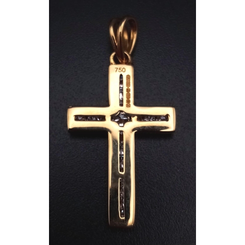 745 - An 18K Yellow Gold Diamond Cross Pendant. 0.5ct. 3cm.
2.7g total weight.