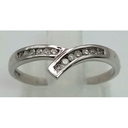 1055 - 9k White Gold Diamond Curved band ring 0.10ct Diamond. 1.4g in weight, Size M.