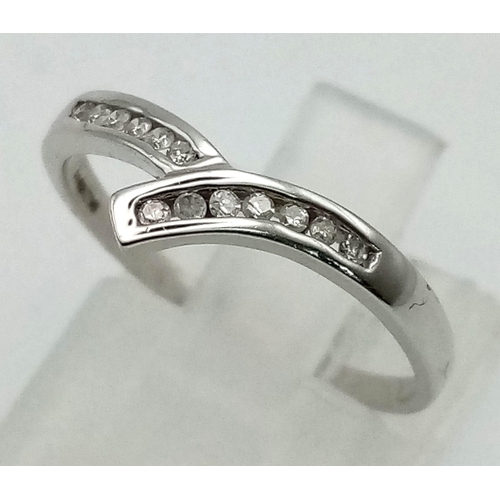 1055 - 9k White Gold Diamond Curved band ring 0.10ct Diamond. 1.4g in weight, Size M.