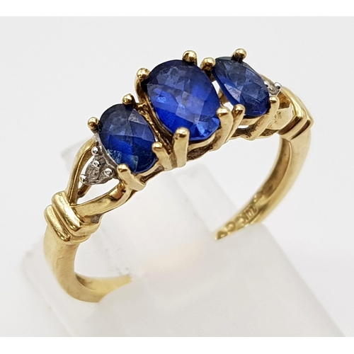 1062 - 9K Yellow Gold Diamond and 3 Blue Stone Ring.
Weighs 2.24g
Size N