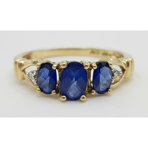 1062 - 9K Yellow Gold Diamond and 3 Blue Stone Ring.
Weighs 2.24g
Size N