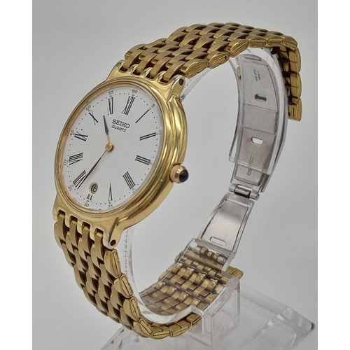 1126 - A Gilded Seiko Quartz Ladies Watch. Case -34mm. White dial with date window. In good condition and w... 