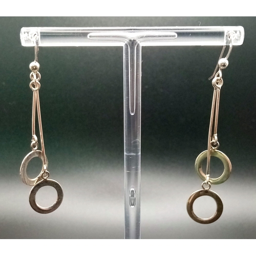 1406 - 2 Sterling Silver drop earrings. Weighs 20.3g