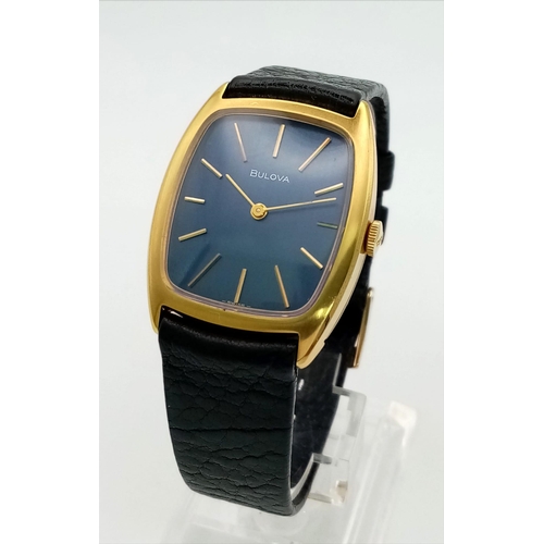 620 - A Vintage Bulova Unisex Watch. Original black leather strap and clasp. Two tone case - 27 x 35mm. Bl... 