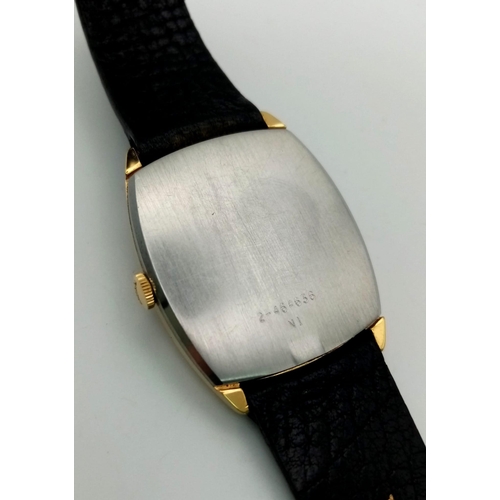 620 - A Vintage Bulova Unisex Watch. Original black leather strap and clasp. Two tone case - 27 x 35mm. Bl... 