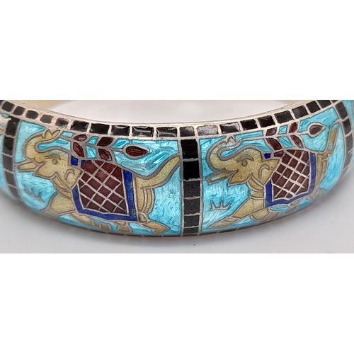 865 - A 155 Ct Silver Enamel Bangle with Traditional motifs and a floral bracelet, Weight 29g.