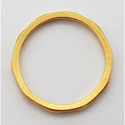 702 - A 22K Yellow Gold Band Ring. Size K. 2.31g.