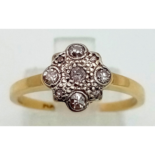 1283 - An 18K yellow gold and platinum ring with a cluster of diamonds ( 0.15 carats). Ring size: N, weight... 