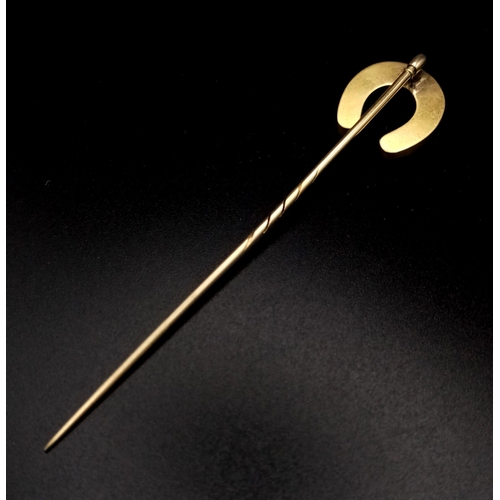 257 - A Victorian High Karat Gold and Diamond Large Horseshoe Stick Pin. 7 diamonds. 9cm length. 5.44g tot... 