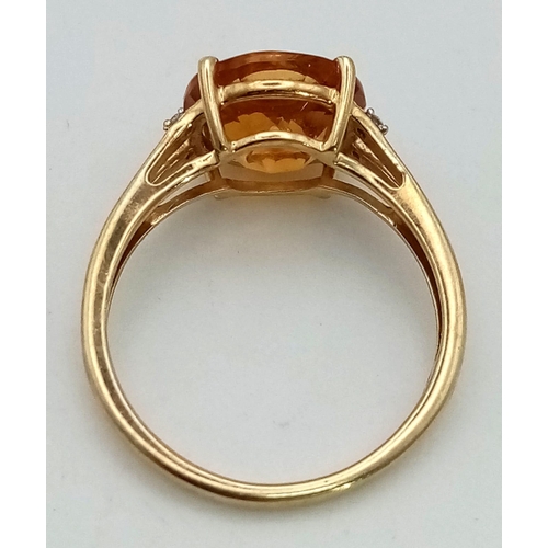 613 - A Vintage 10K Gold Citrine and Diamond Ring. Fancy cut central citrine with small diamonds on wings.... 