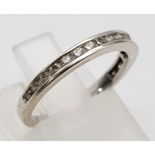 800 - 14K White Gold Diamond half eternity ring. 0.25ct diamond, Weighs 1.6g and is a Size J