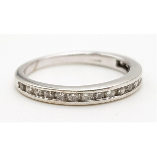 800 - 14K White Gold Diamond half eternity ring. 0.25ct diamond, Weighs 1.6g and is a Size J