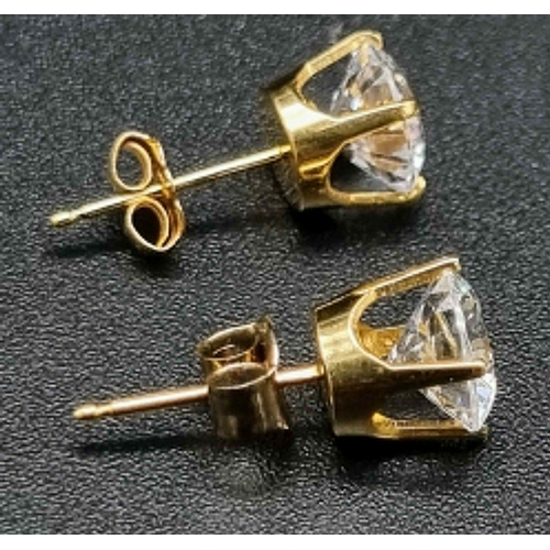 831 - A Pair of 18K Yellow Gold High-Grade CZ Stud Earrings. 1.62g total weight.