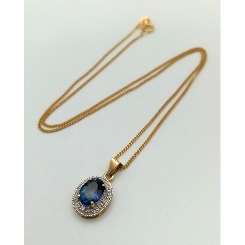 845 - A Mystic Opal and Diamond Pendant set in 9K Gold on a 9K Gold Necklace. 20mm pendant. 40cm necklace.... 