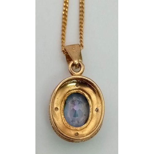 845 - A Mystic Opal and Diamond Pendant set in 9K Gold on a 9K Gold Necklace. 20mm pendant. 40cm necklace.... 