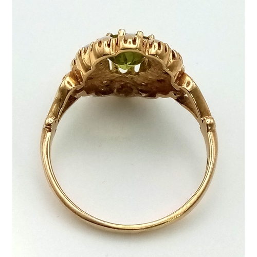 856 - An Antique 9K Yellow Gold Peridot and Seed Pearl Ring. Central oval peridot with a seed pearl surrou... 