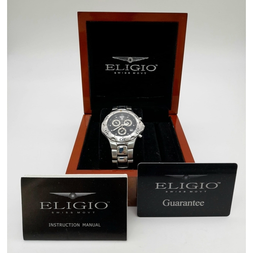 1091 - An Eligio Chronograph Gents Watch. Stainless steel strap and case - 36mm. Black dial with three sub ... 